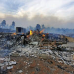 Wildfires merge in New Mexico, threatening rural villages